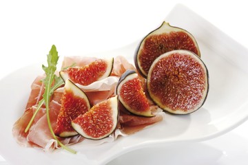 Fresh Figs (Ficus carica) with rucola on a plate