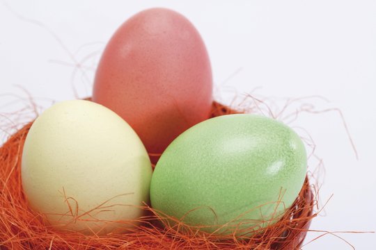 Pastel-coloured Easter eggs in a nest