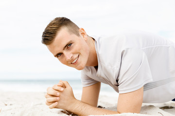 Man training on beach outside