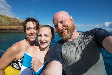 Family selfie on tropical vacation