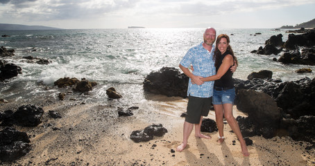 Fototapeta na wymiar Middle aged couple together on island beach