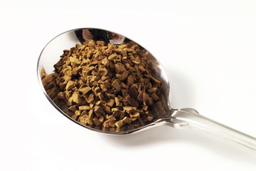 Granulated coffee, soluble coffee on spoon