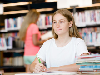 Teenage girl with books