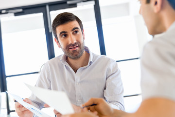 Obraz premium Image of two young business people in office