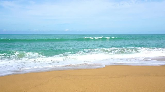 tropical andaman seascape scenic off patong beach phuket thailand with wave crashing on sandy shore
