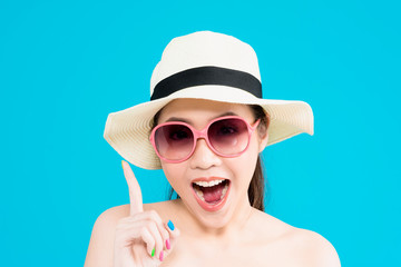 Young Asian woman thinking isolated on blue background.