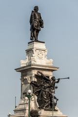 Statue of Samuel de Champlain against blue summer sky in historic area founder of Quebec City, Canada