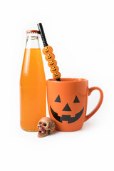 halloween coffee cup mug drink with skull and juice bottle and tube on white isolated