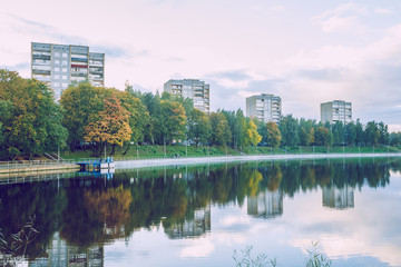 Fototapeta na wymiar Jugla lake in Riga, autumn, yellow tree leaves. 2017