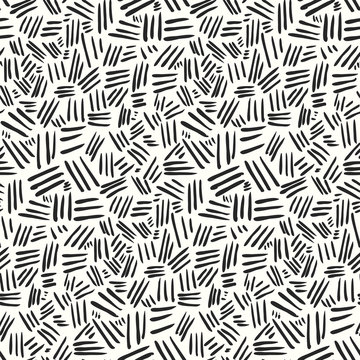 Abstract pattern with hand drawn chaotic black strokes on white. Vector fashion texture for textile, wrapping paper, cover, surface, wallpaper, background