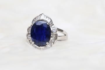 Blue gemstone on silver ring