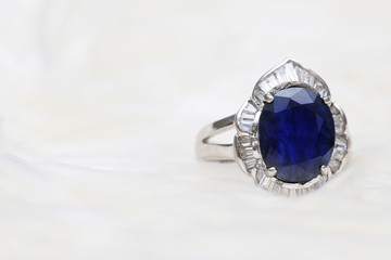 Blue gemstone on silver ring