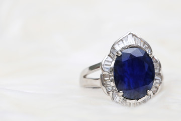Blue gemstone on silver ring