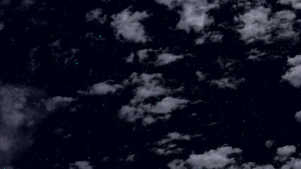 clouds float against the background of the night starry sky and twinkling stars.