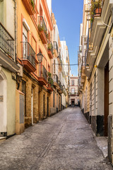 Fototapeta premium Colourful street in the Spanish city of Cadiz