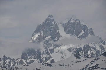 Ushba peak in the Caucasus Mountains. Snowy playing.