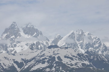 Fototapeta na wymiar Ushba peak in the Caucasus Mountains. Snowy playing.