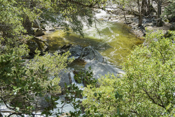 Merced river with snow and mountains