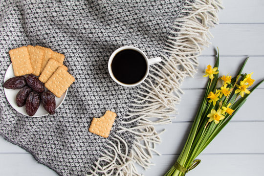 Cup Of Coffee, Cracker Biscuit Cookies, Date Fruits And Daffodil Flowers. Top View, Flat Lay