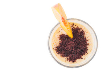 Glass of peach smoothie with chocolate