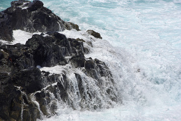 Broken Waves And Lava Rock