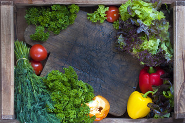 fresh green vegetables on a wooden background. vitamin food
