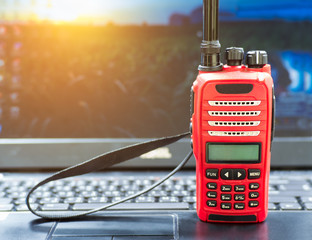 Red Radio Communication (walkies talkies). Close up of Amateur Radio top on laptop on the working...