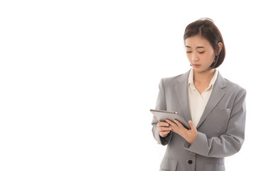 Portrait of asian businesswoman touching digital tablet and looking at it. This picture for working woman concept.