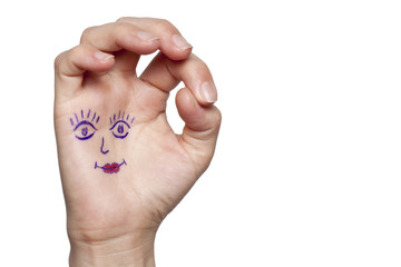 Female hand with painted eyes and lips, isolated
