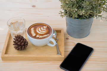 cup of coffee on wooden table. latte art coffee.