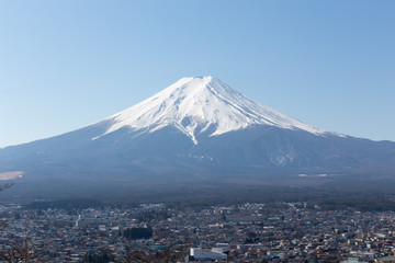 Naklejka premium Fuji mountain and Fujiyoshida city with blue sky in the morning