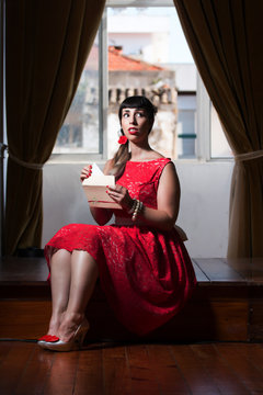 Pinup girl reading a romantic letter