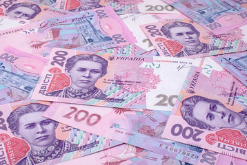 Fototapeta na wymiar Background of two hundred Ukrainian hryvnia banknotes