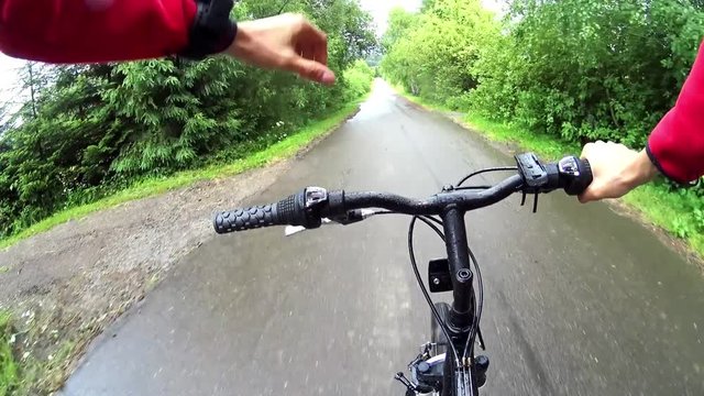 Mountain biker during downhill in Bieszczady mountains in Poland, first person view