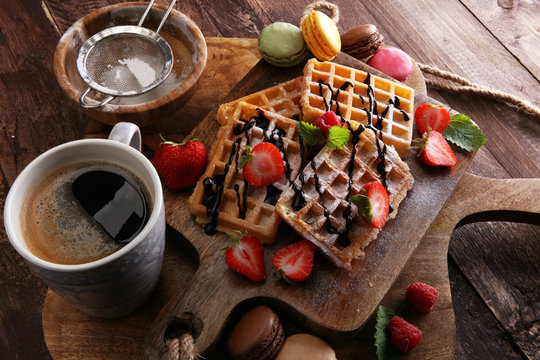 Belgian waffles with strawberries and raspberries, homemade healthy breakfast with coffee