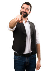 Fototapeta premium Cool man pointing to the front on isolated white background