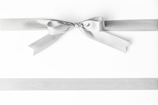 Silver ribbon pearl satin stripe band fabric bow isolated on white background with clipping path