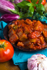Best italian food - sicilian caponata with eggplants, tomatoes, onion, garlic and herbs