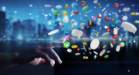 Businessman holding and touching floating medicine pills 3D rendering