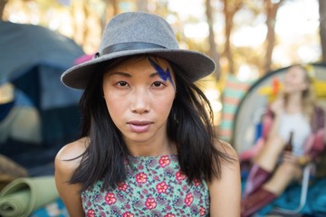 Portrait of young woman wearing gray hat