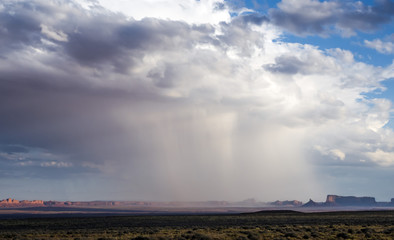 Isolated rainstorm at the Monument Valley with - View from US Hwy 163, Monument Valley, Utah, USA