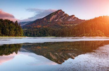 Great view of the azure pond Obersee glowing by sunlight. Location Nafels, Swiss alps, Europe.