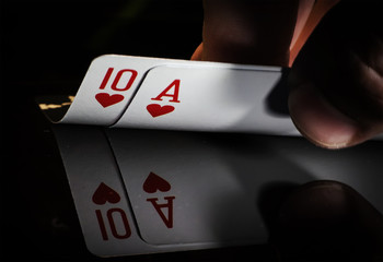 hand holding best classic winning blackjack combination ten and ace