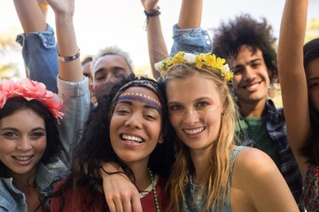 Portrait of friends enjoying at music festival - Powered by Adobe