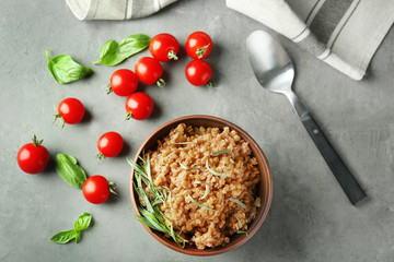 Bowl with boiled lentils on table