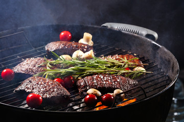 Delicious cooked meat with vegetables on grill