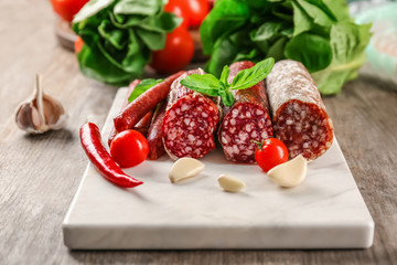 Smoked tasty sausages on board