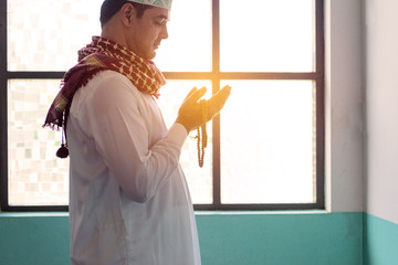 Islam muslim man praying in Mosque