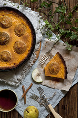 Homemade pie cooked from apples and pumpkin on rustic wooden background. Autumn concept, top view