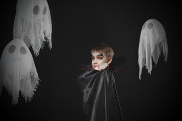 Portrait vampire boy in studio